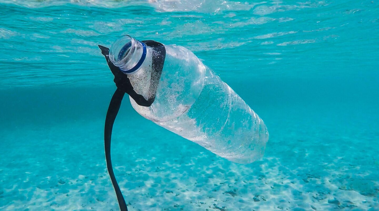 Plastic water bottle floating in ocean